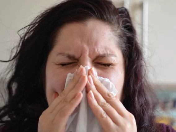 a person blowing their nose